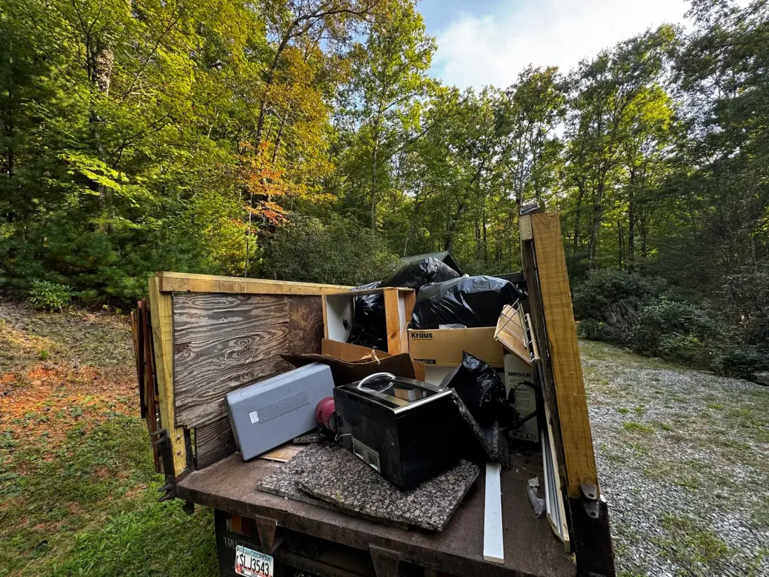 The truck bed loaded with cabinets, an appliance and debris from a Gainesville commercial clear-out