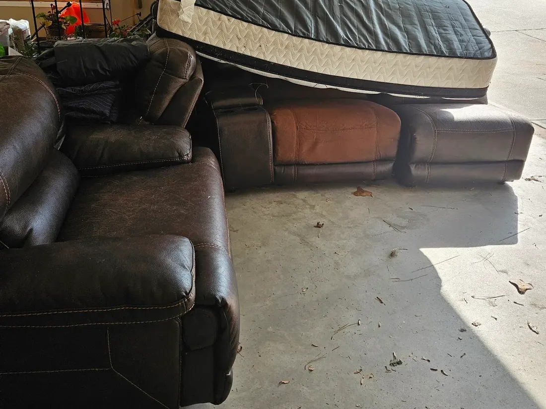 Furniture carried out and staged during an estate cleanout at a Canton river property